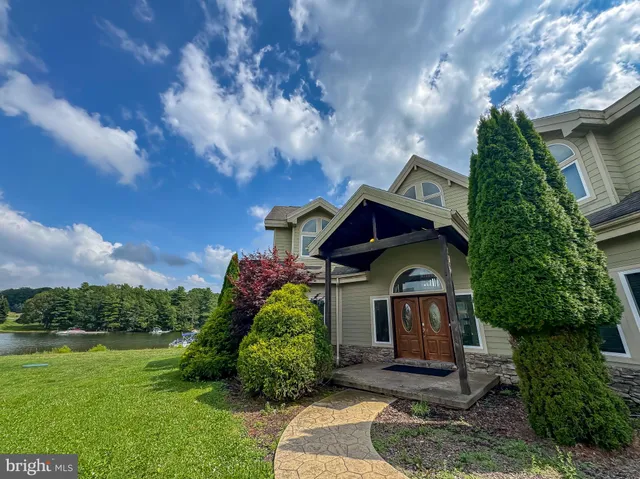 a view of an outdoor swimming pool and an outdoor seating