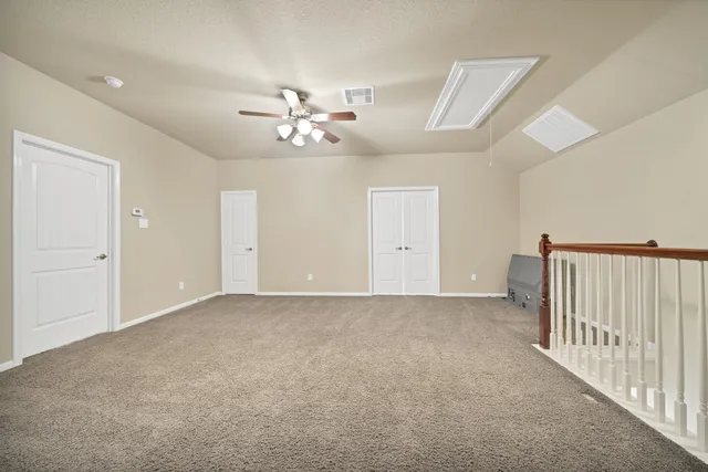 a bathroom with a sink toilet vanity and shower