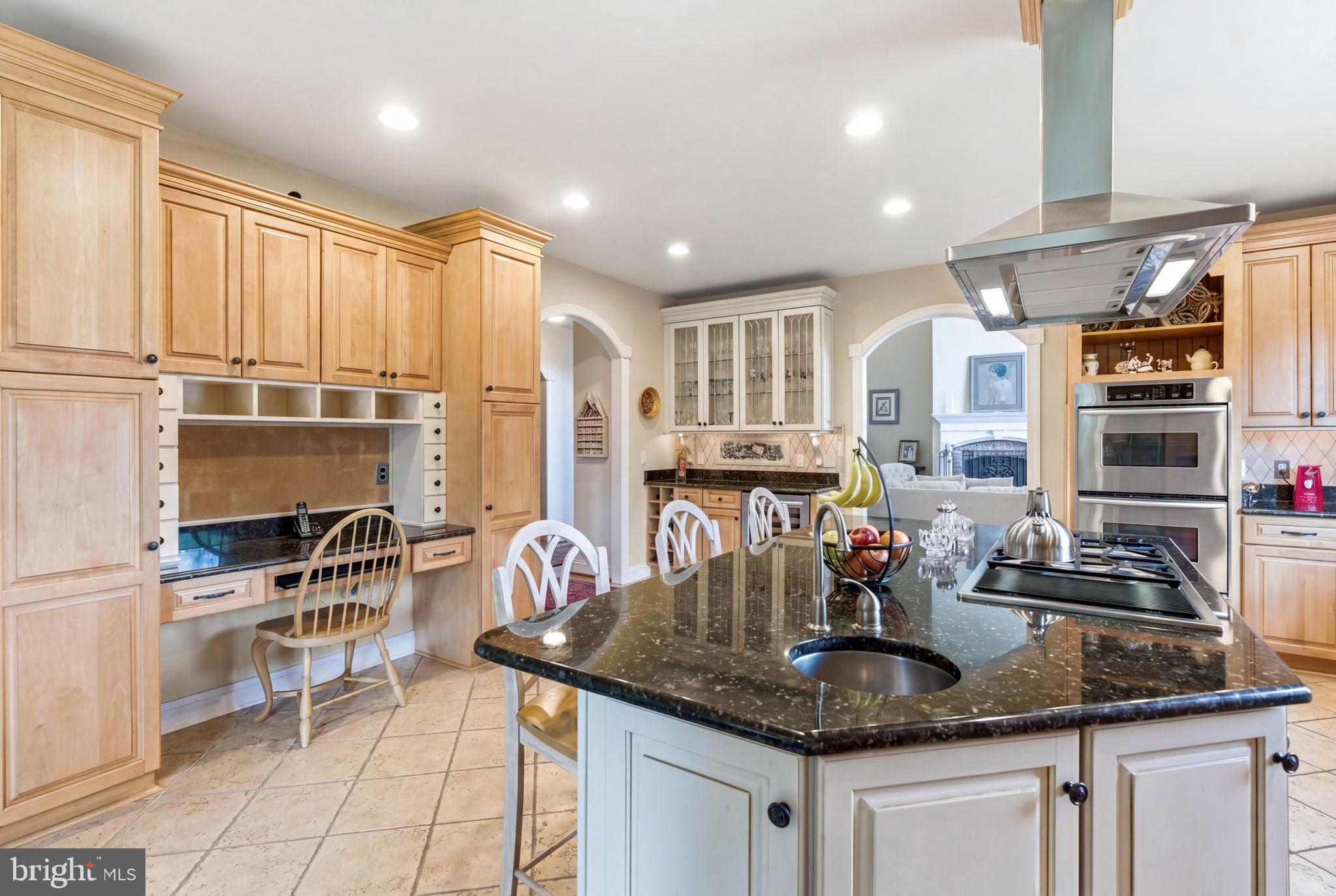 9 Deer Ridge Court Phoenix, MD 21131 - Photo 33 of 96 a kitchen with stainless steel appliances granite countertop a sink and cabinets