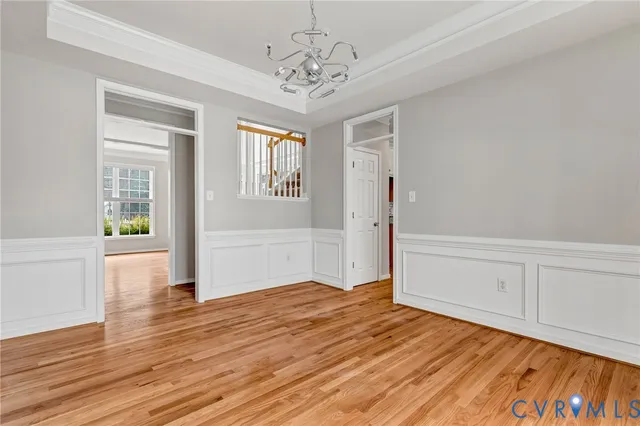 a view of a kitchen with wooden floor and a kitchen