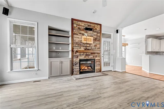 a bathroom with a granite countertop sink and a large mirror