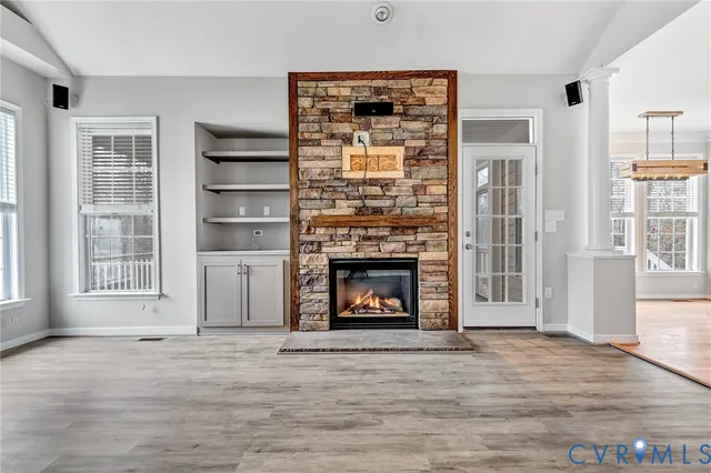 a kitchen with stainless steel appliances granite countertop a sink refrigerator and cabinets