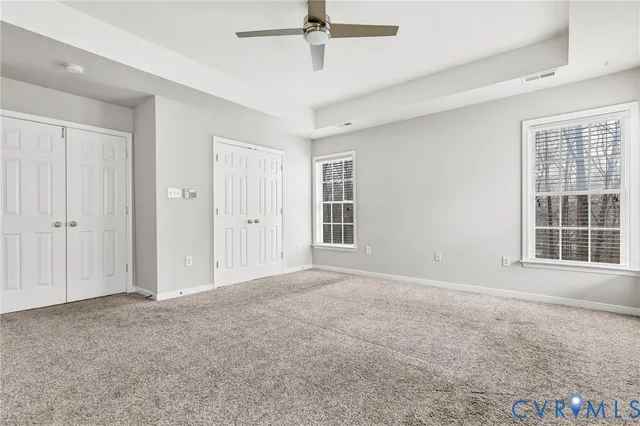 a view of large space with a wooden fence