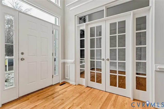 a view of a kitchen with wooden floor and a sink
