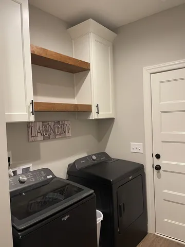 a kitchen with a stove and a cabinet