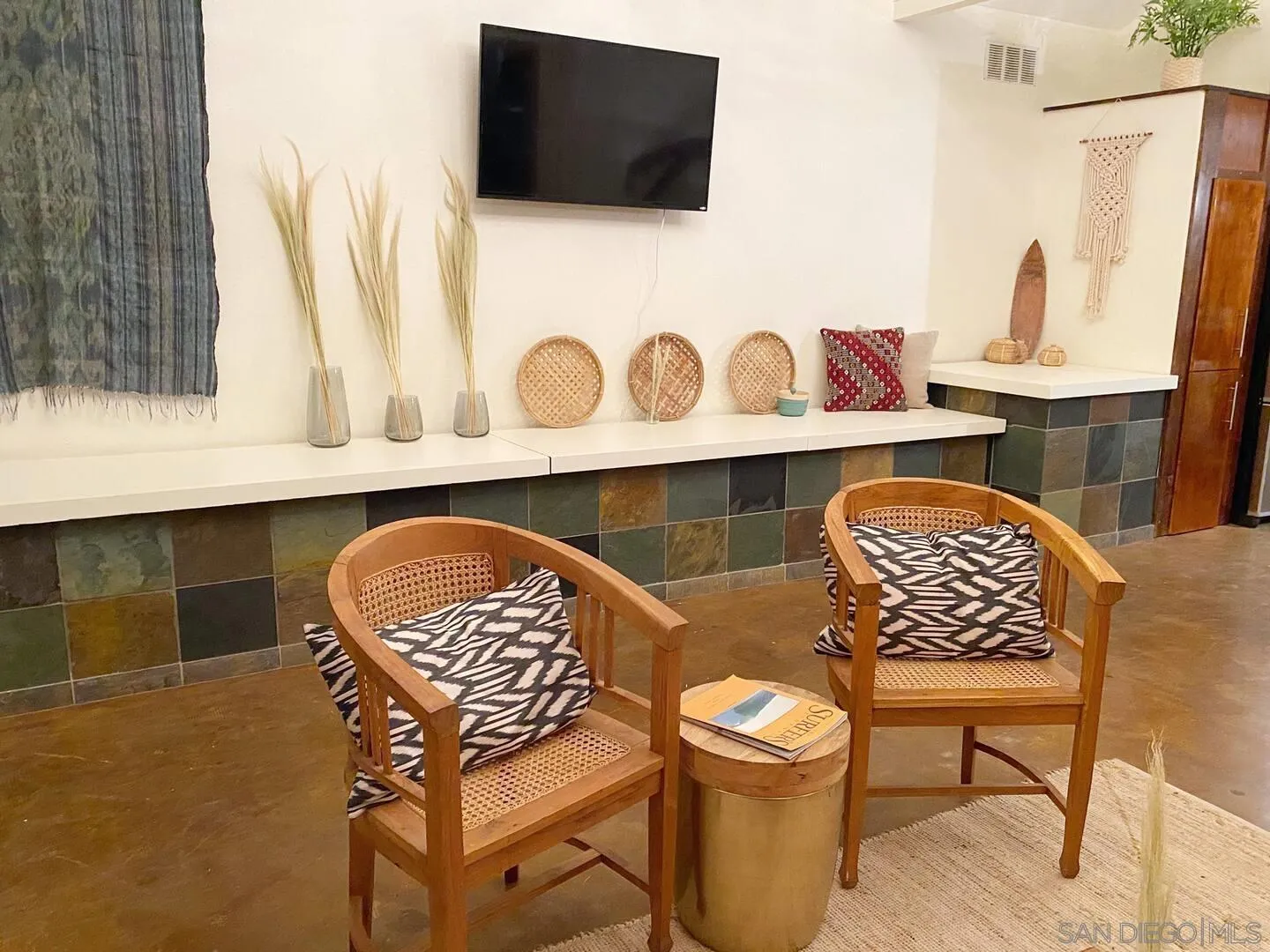 513 3rd Street Encinitas, CA 92024 - Photo 14 of 22 a front view of a house with seating space