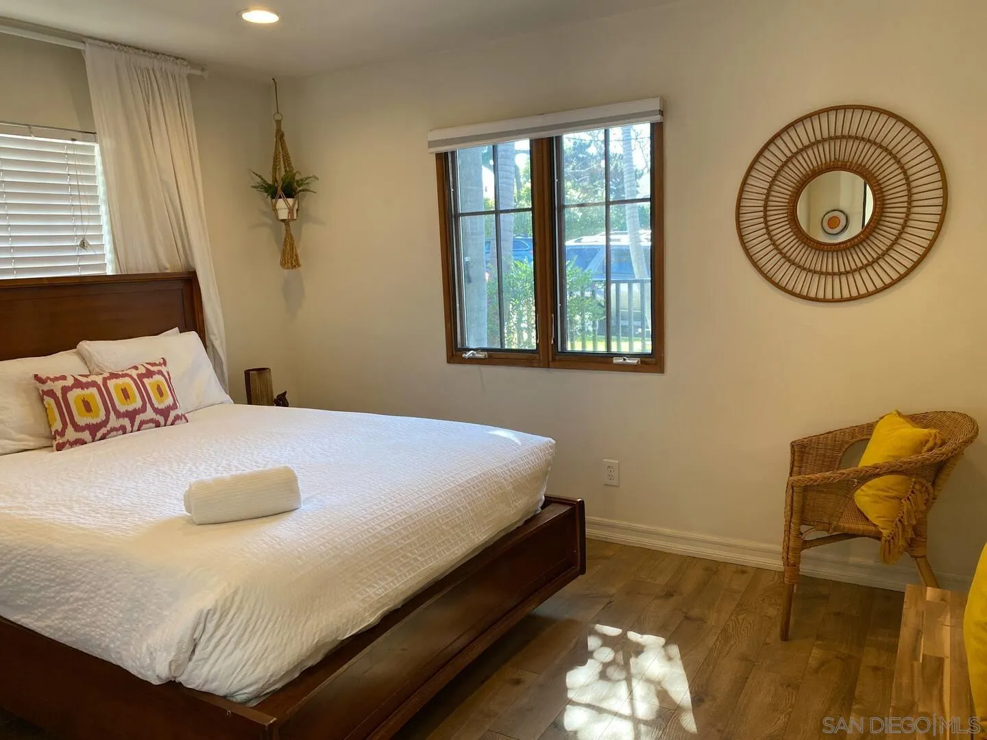 513 3rd Street Encinitas, CA 92024 - Photo 10 of 22 a bedroom with a bed and a chair