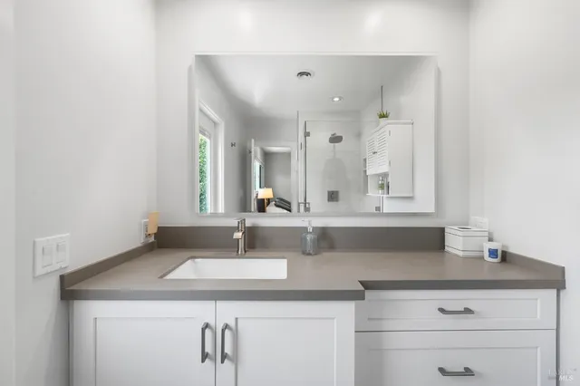 a bathroom with a sink and a mirror