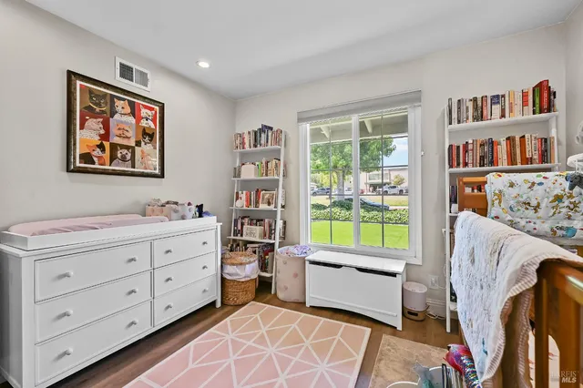 a room with furniture toys and a window