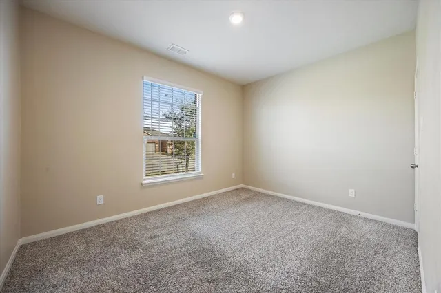 a bathroom with a granite countertop toilet a sink and a bathtub