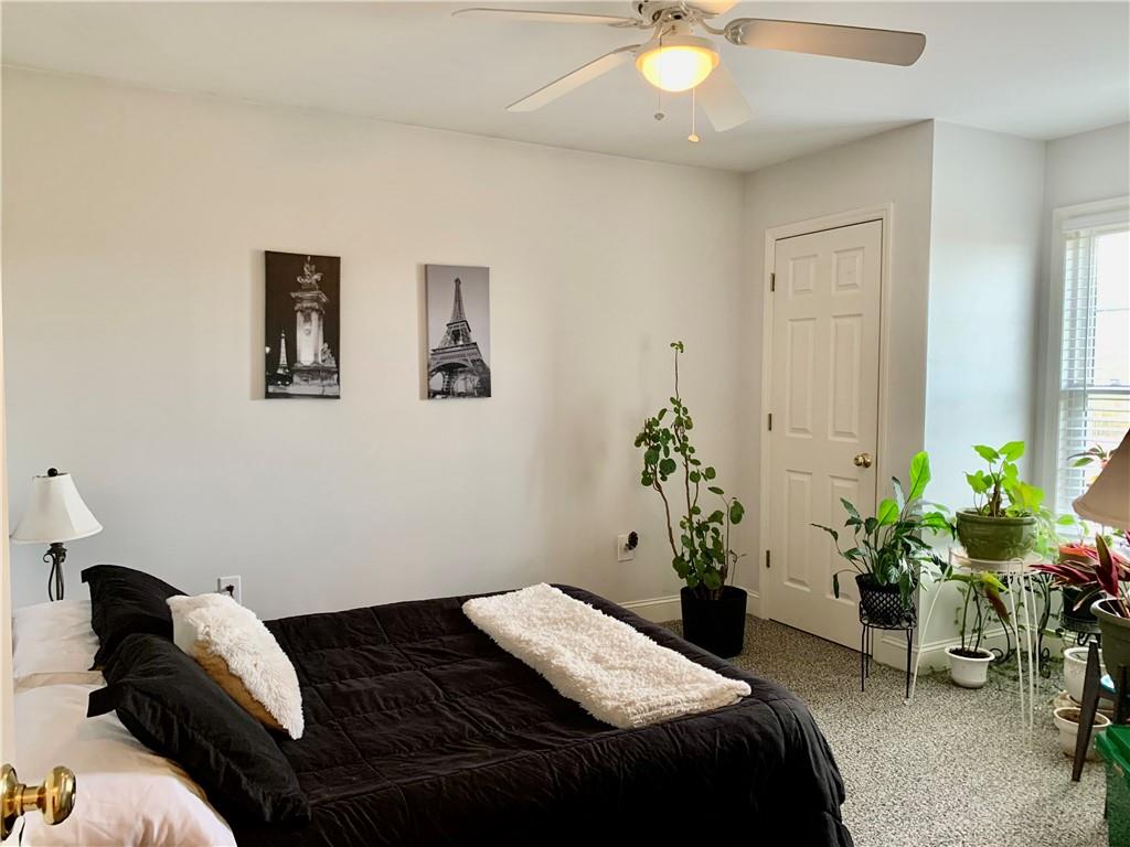 6911 Alexander Farm Road Monroe, NC 28110 - Photo 25 of 48 a bedroom with a bed and a potted plant