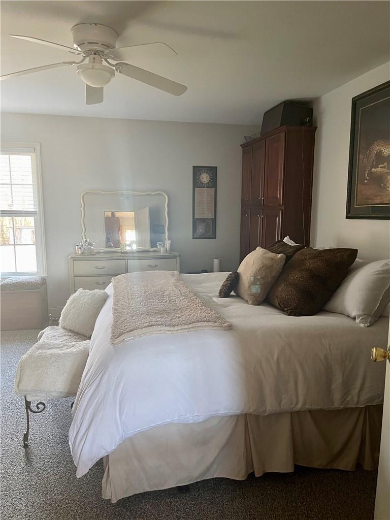 6911 Alexander Farm Road Monroe, NC 28110 - Photo 28 of 48 a bedroom with a bed and wooden floor