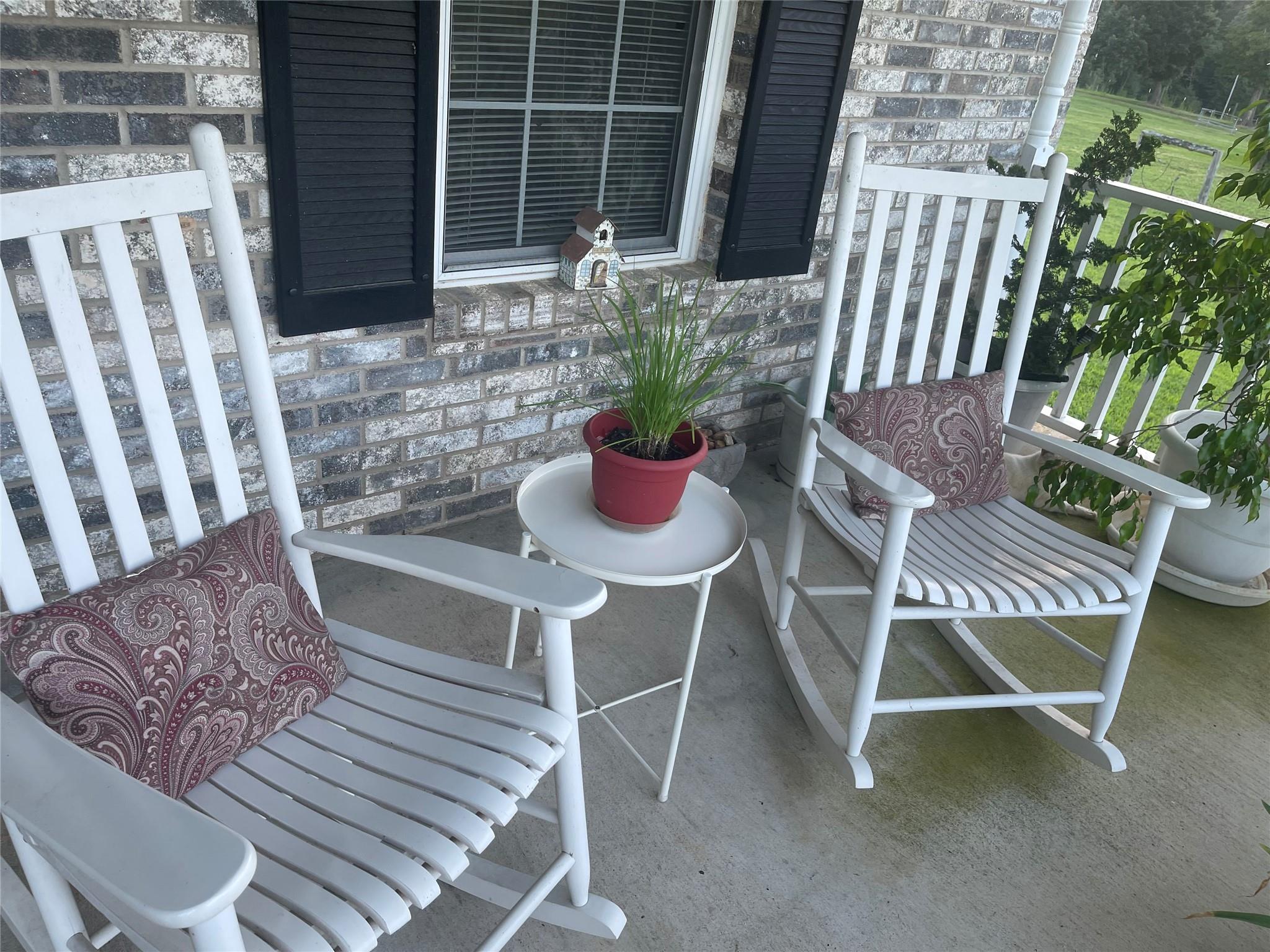 6911 Alexander Farm Road Monroe, NC 28110 - Photo 37 of 48 a wooden bench sitting in front of a building