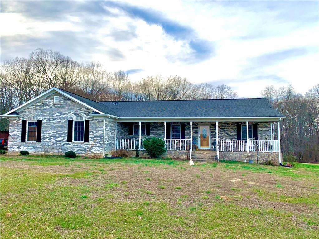 6911 Alexander Farm Road Monroe, NC 28110 - Photo 6 of 48 a front view of house with yard and green space