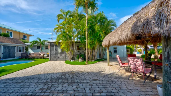 a bed room with a bed and a chair