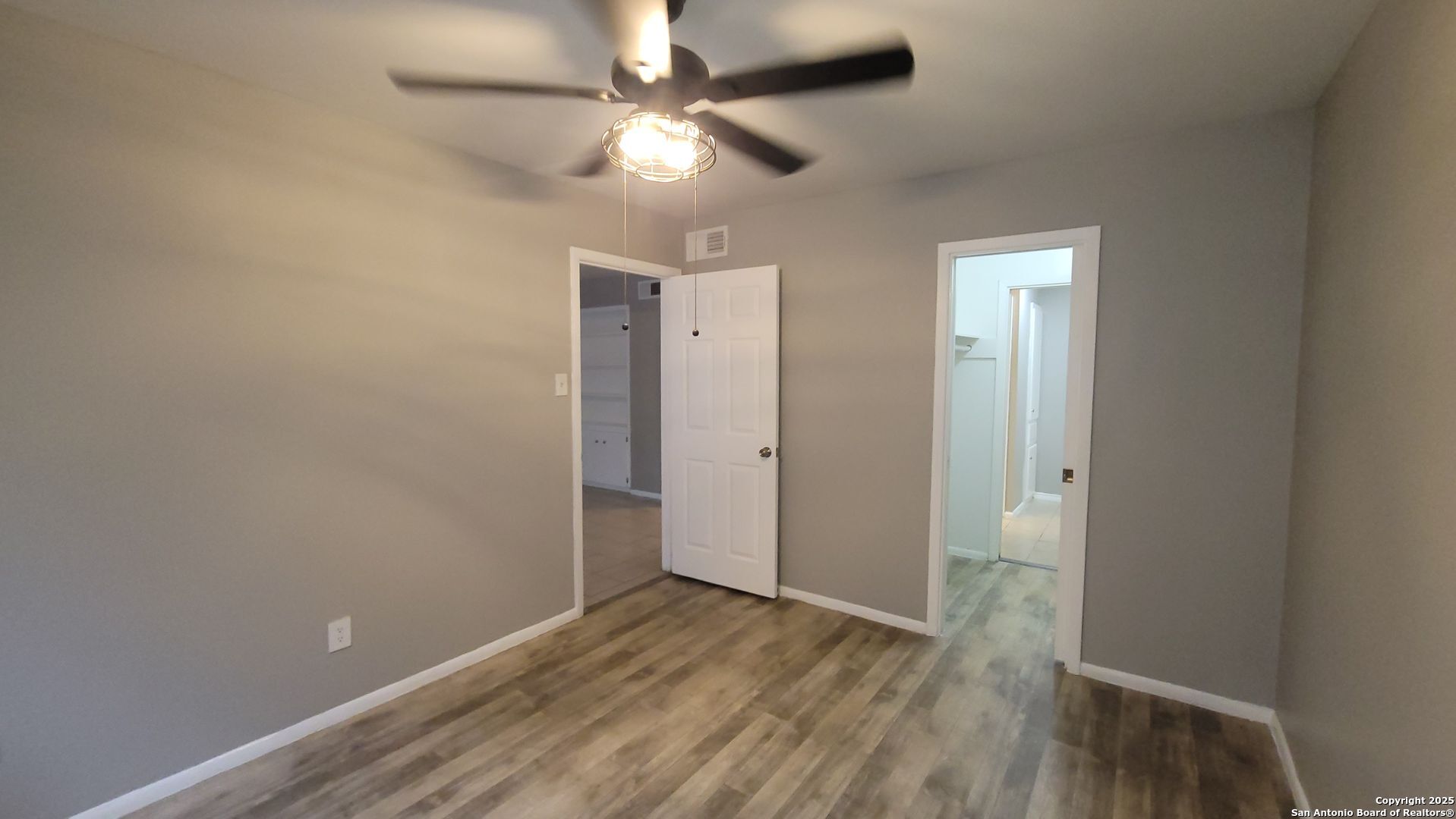 516 Gentleman Road, Unit 5 Balcones Heights, TX 78201 - Photo 12 of 15 wooden floor in an empty room with a window