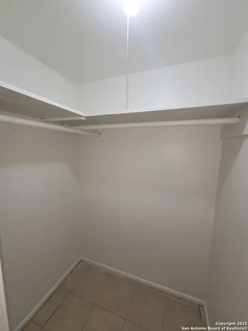 a view of an empty walk in closet