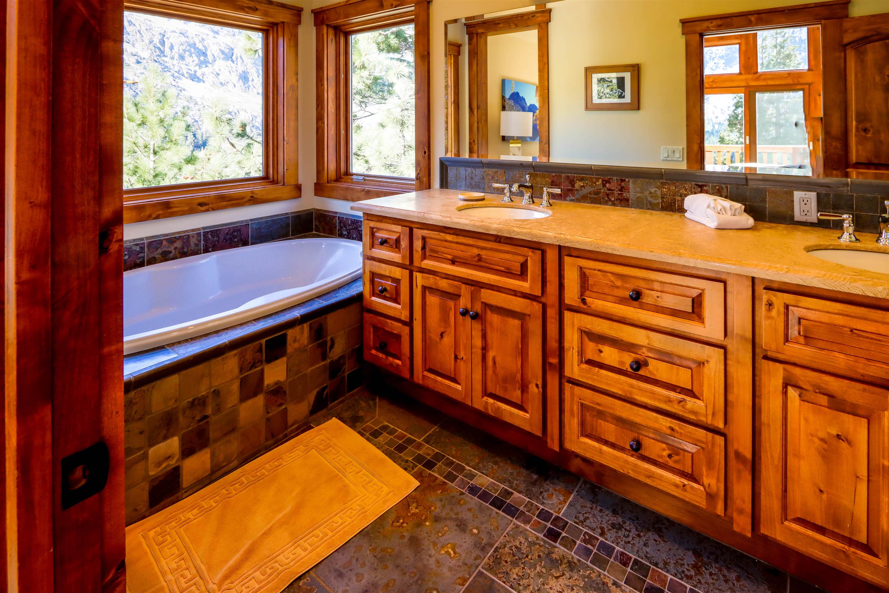 131 West Steelhead Road June Lake, CA 93529 - Photo 18 of 47 a bathroom with a sink a bathtub and next to a window