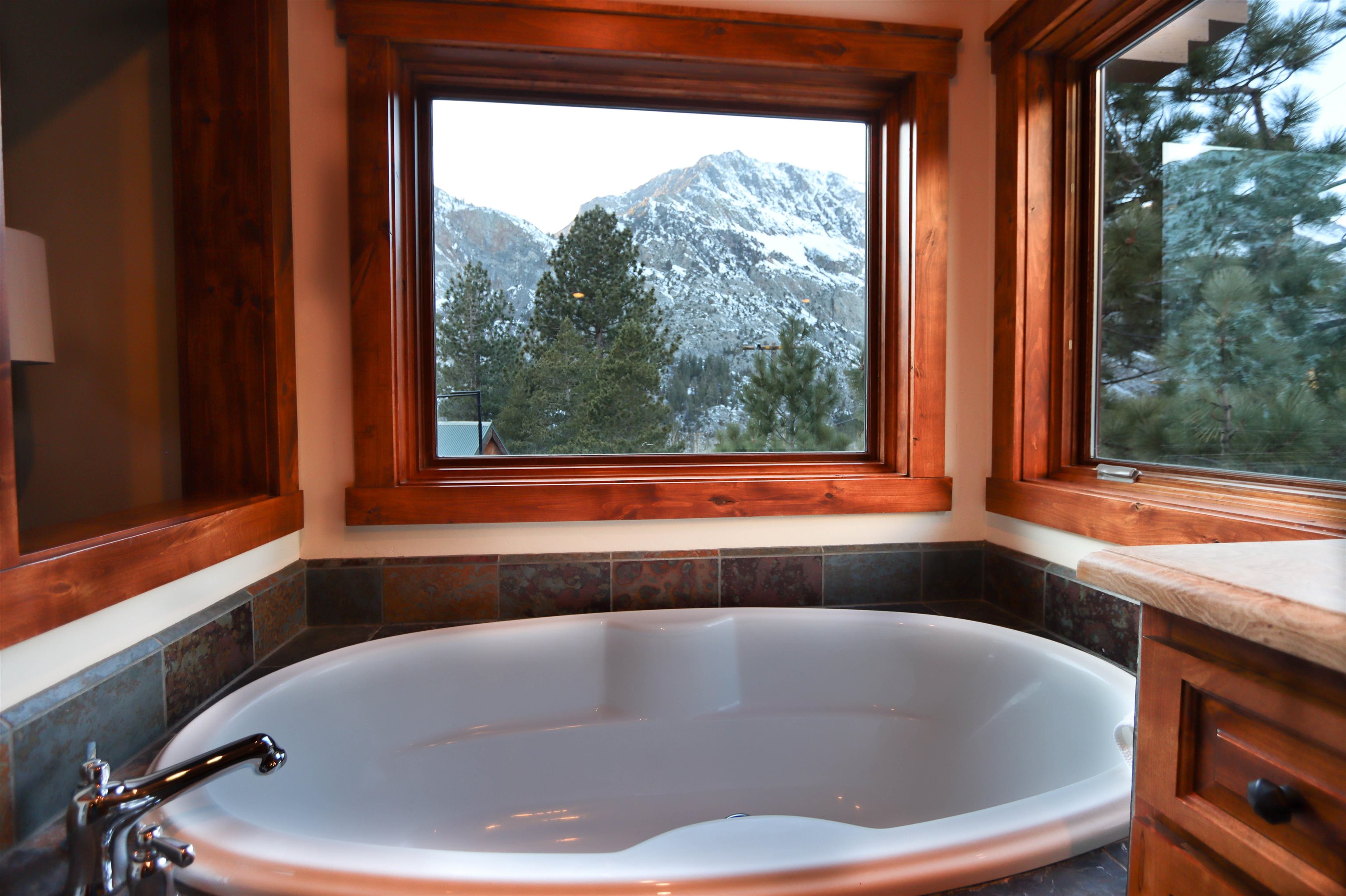 131 West Steelhead Road June Lake, CA 93529 - Photo 19 of 47 a bath tub sitting in a bathroom next to a window
