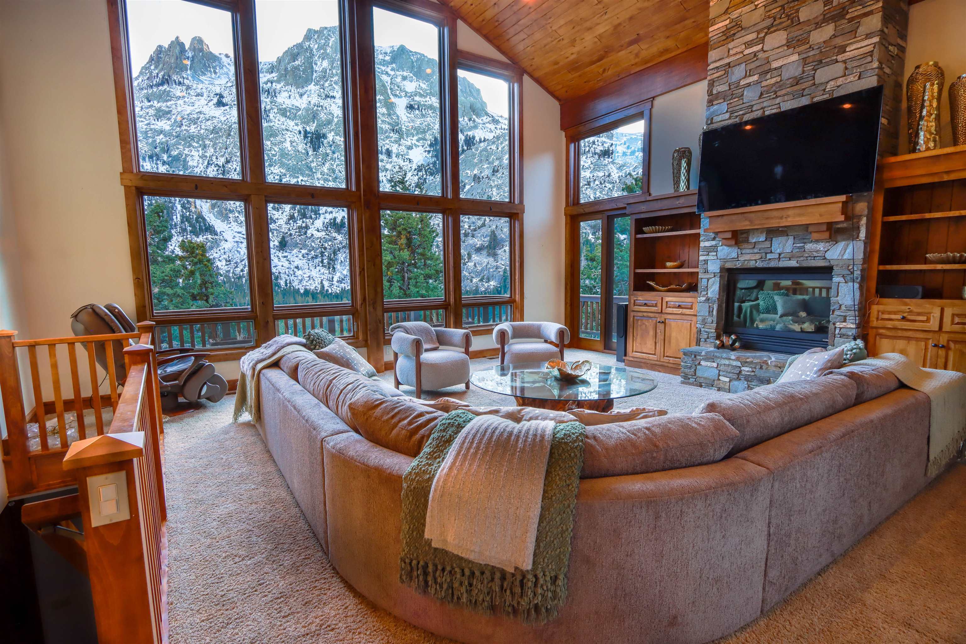 131 West Steelhead Road June Lake, CA 93529 - Photo 2 of 47 a living room with fireplace furniture and a floor to ceiling window