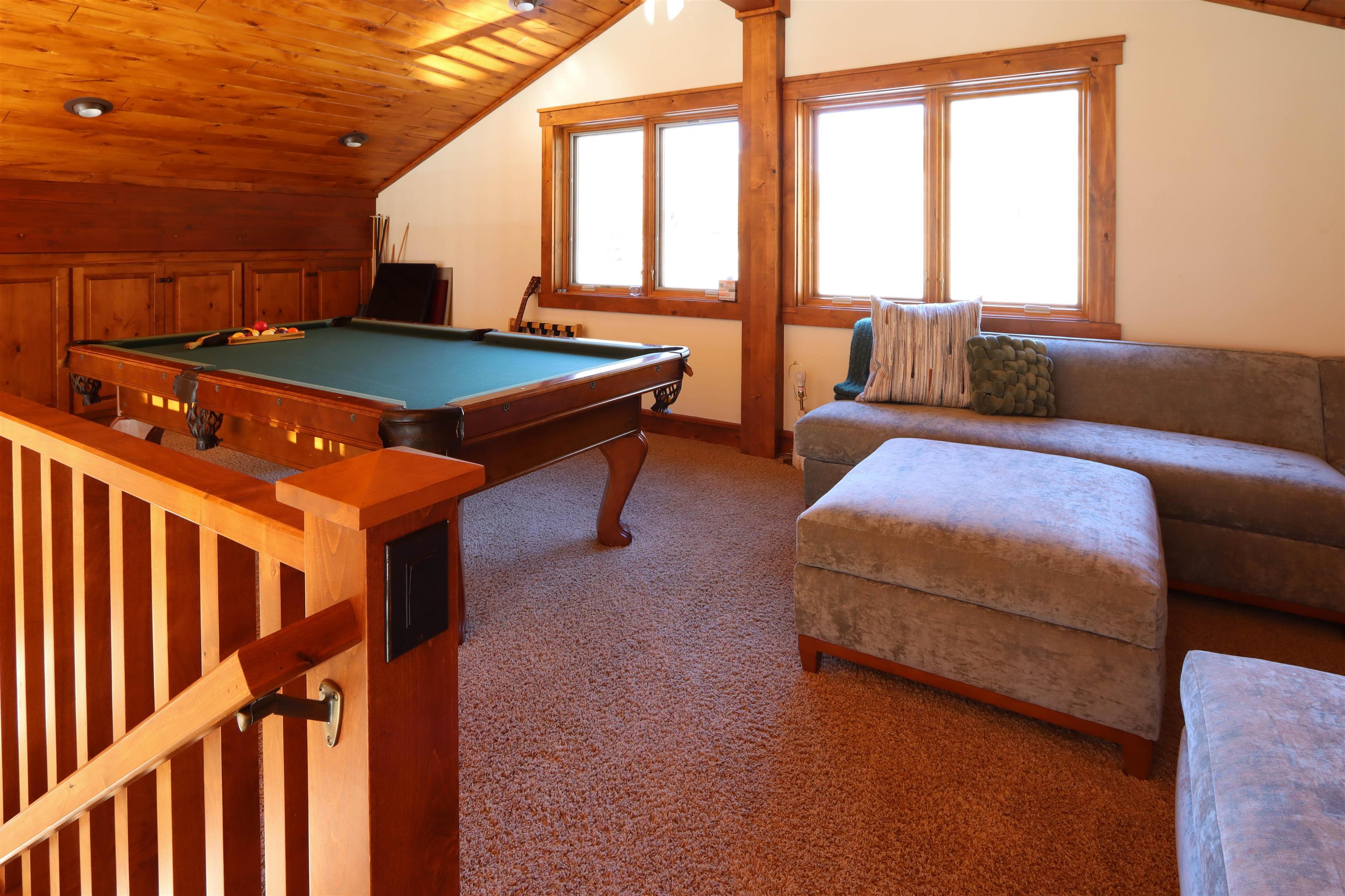 131 West Steelhead Road June Lake, CA 93529 - Photo 24 of 47 a living room with furniture a large window and a rug