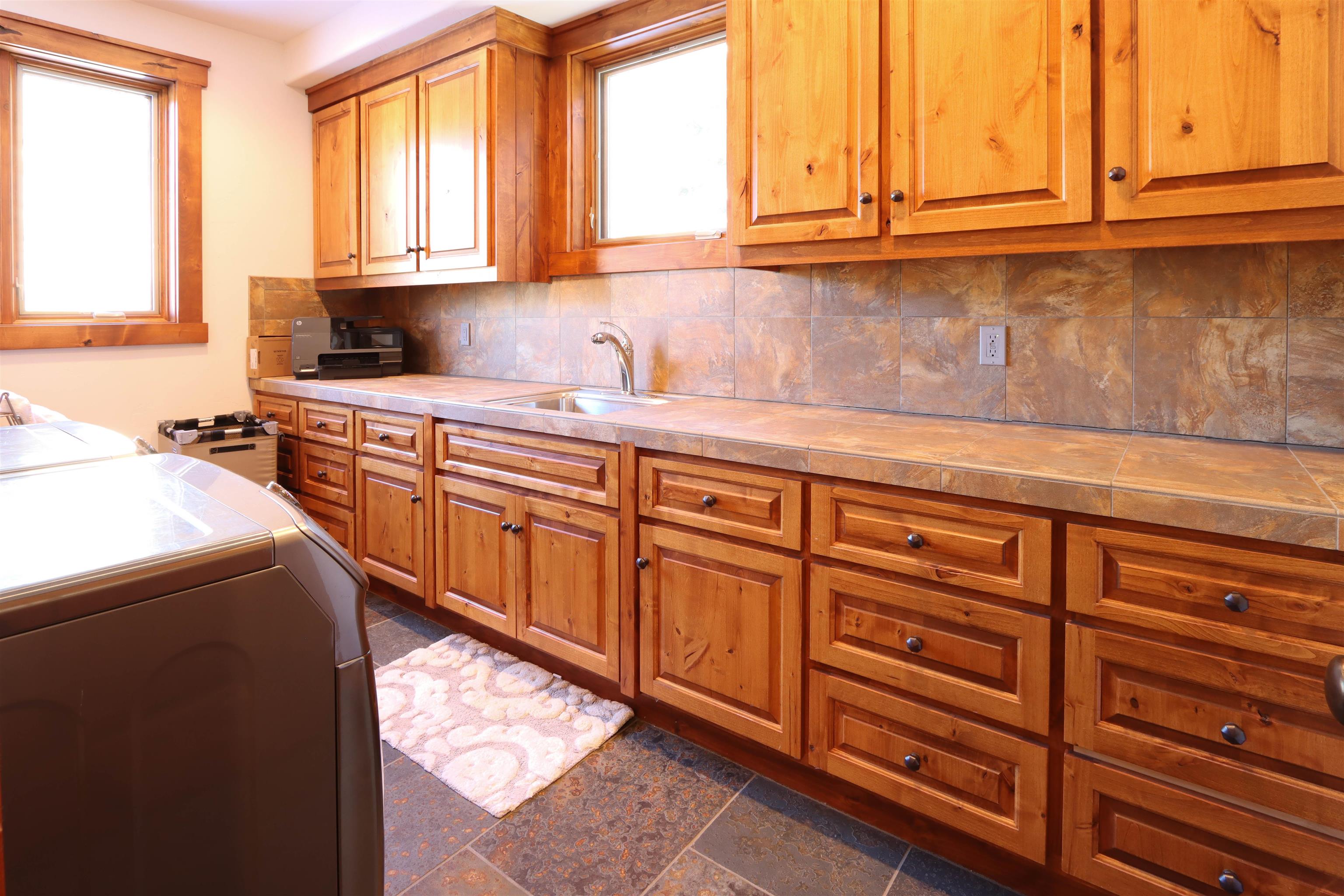 131 West Steelhead Road June Lake, CA 93529 - Photo 29 of 47 a kitchen with stainless steel appliances granite countertop a sink and cabinets