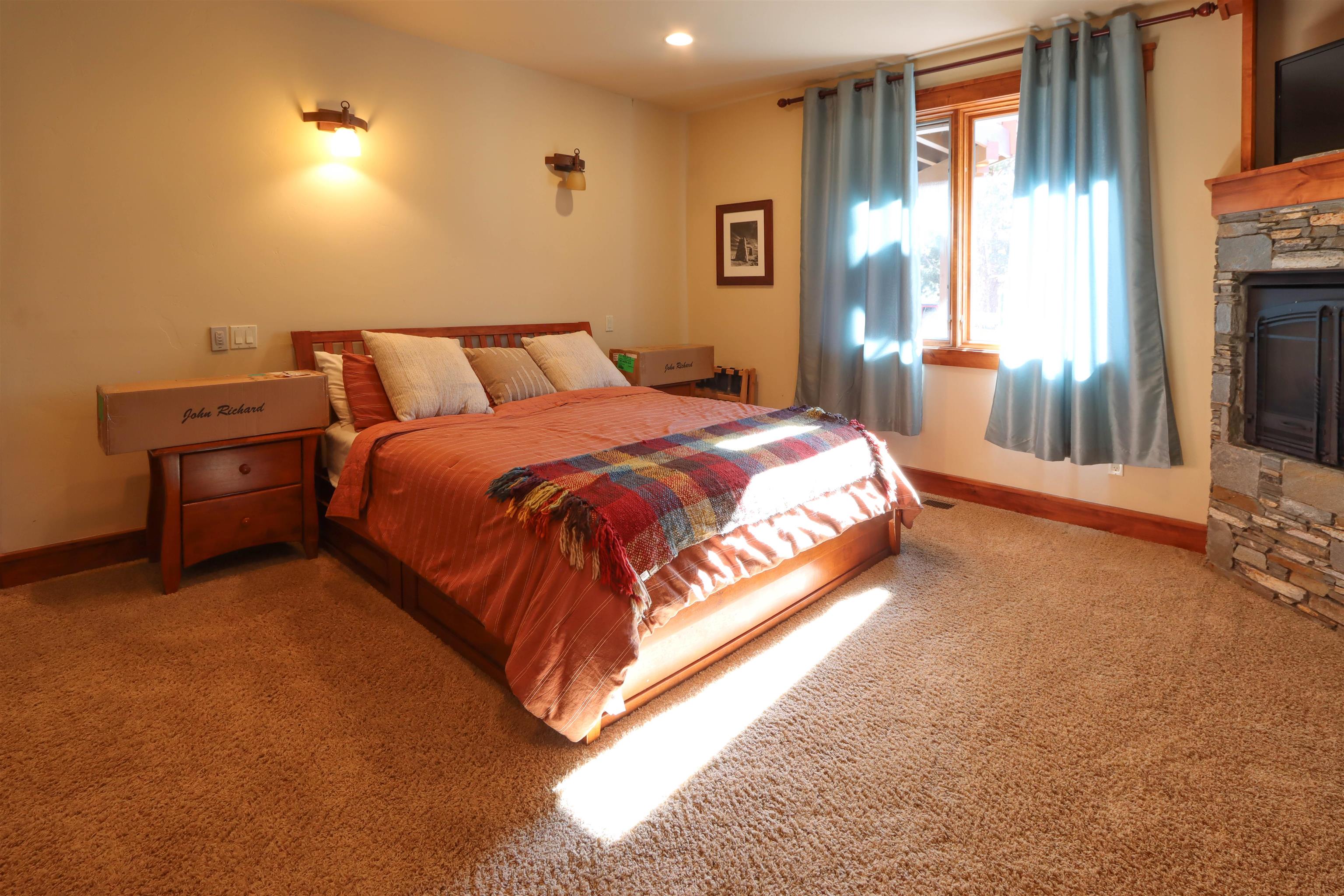 131 West Steelhead Road June Lake, CA 93529 - Photo 33 of 47 a bedroom with a bed and a flat screen tv