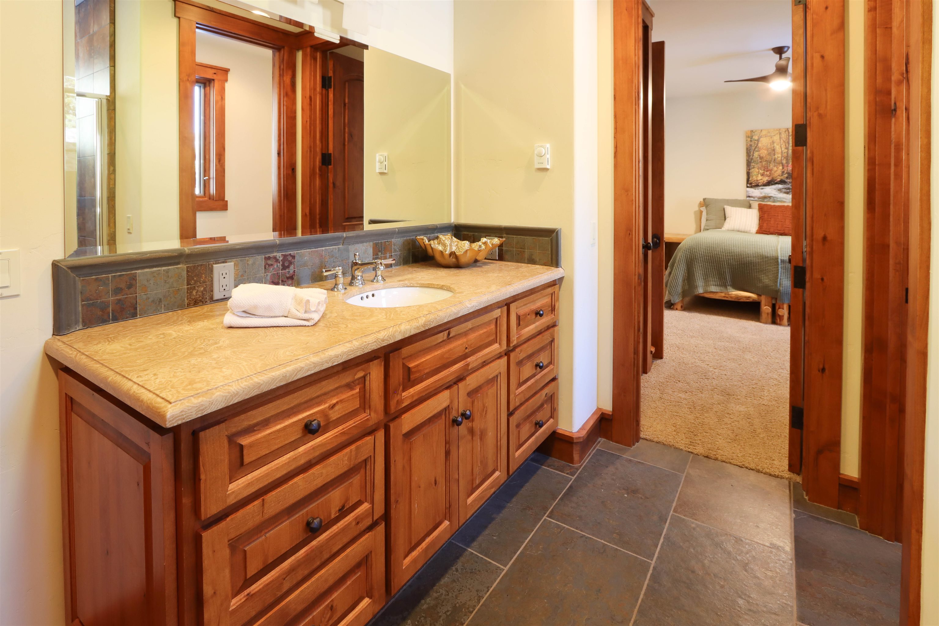 131 West Steelhead Road June Lake, CA 93529 - Photo 36 of 47 a bathroom with a sink a mirror and a shower