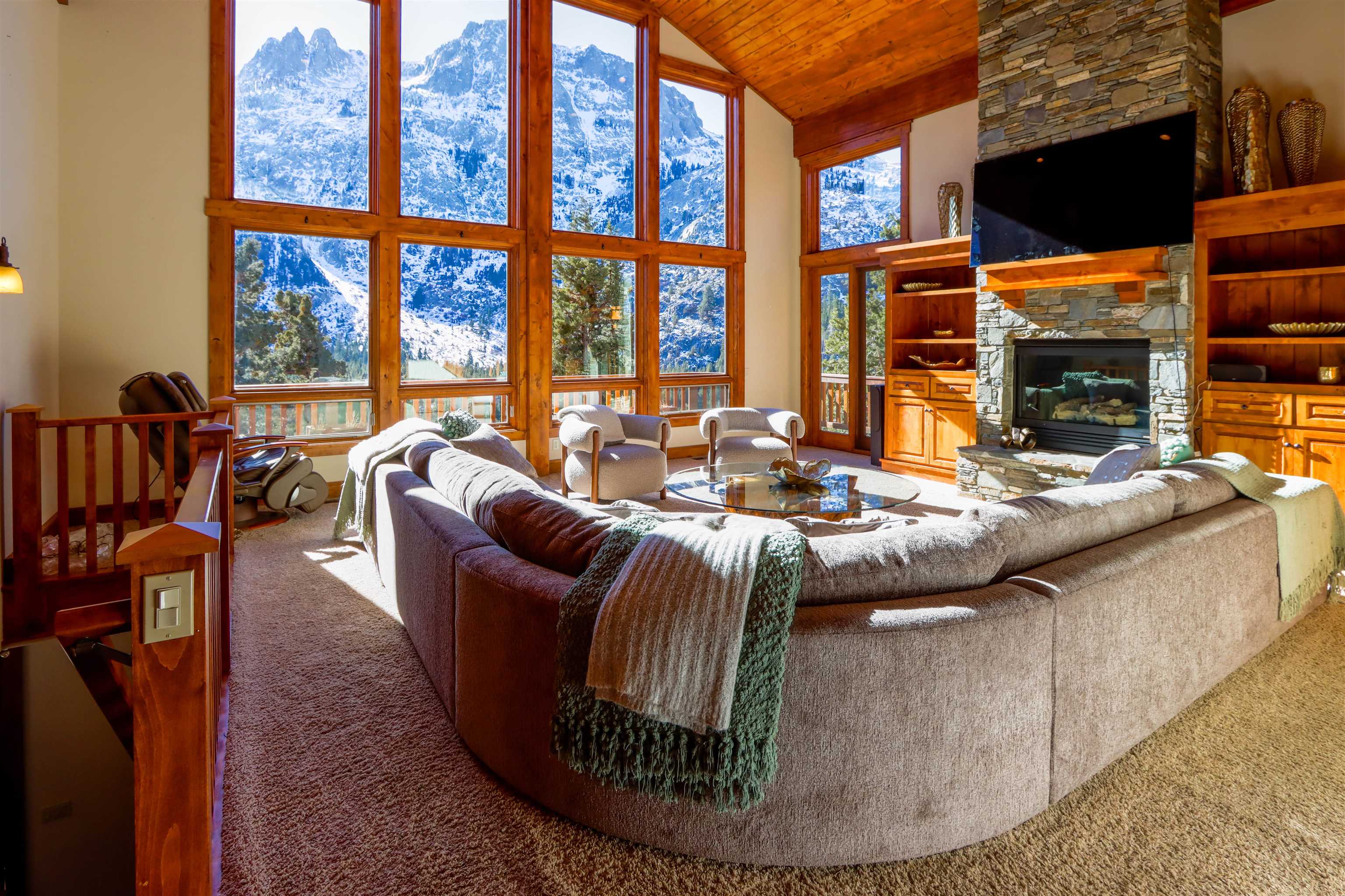 131 West Steelhead Road June Lake, CA 93529 - Photo 5 of 47 a living room with fireplace furniture and a floor to ceiling window