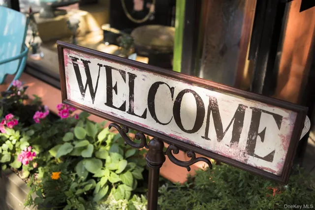 a view of a backyard with swimming pool and outdoor seating