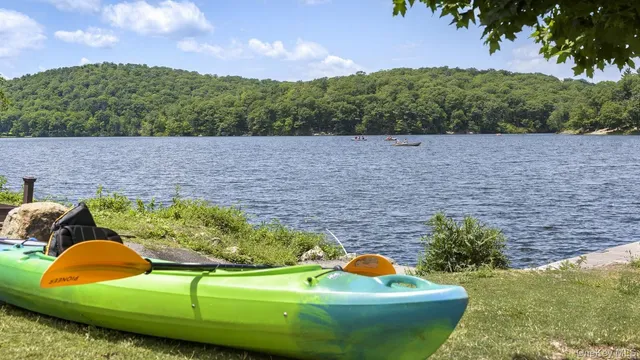 a view of a chairs and table in the balcony