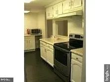 a kitchen with a sink and a stove