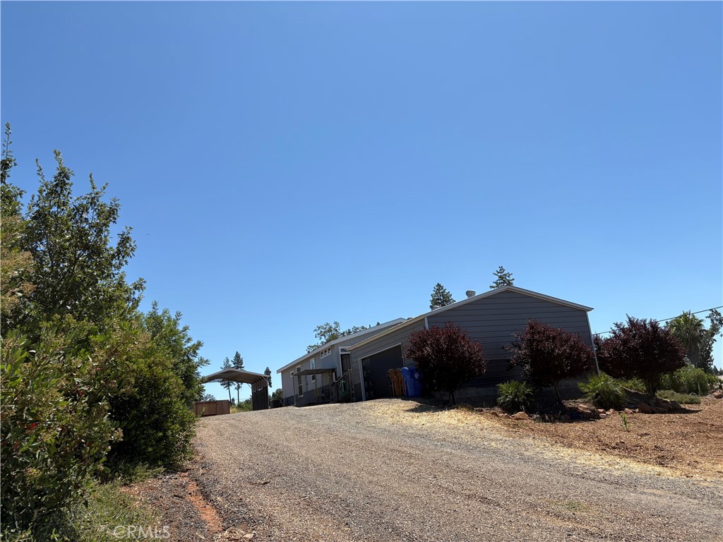 5548 Newland Road Paradise, CA 95969 - Photo 22 of 23 a view of house with a yard and covered in snow