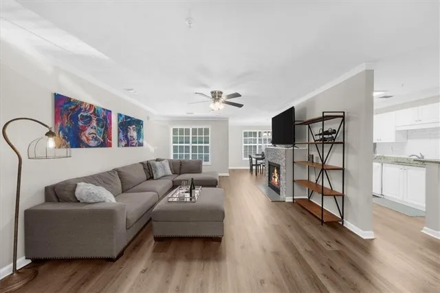 a living room with furniture and wooden floor