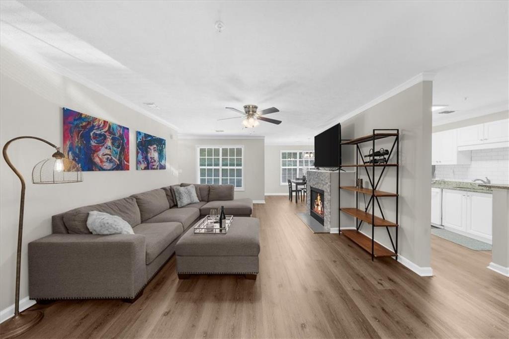 123 Streamside Drive Roswell, GA 30076 - Photo 12 of 36 a living room with furniture and wooden floor