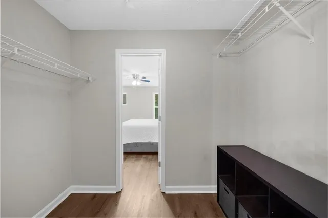 a room that has a bed and a wooden floor