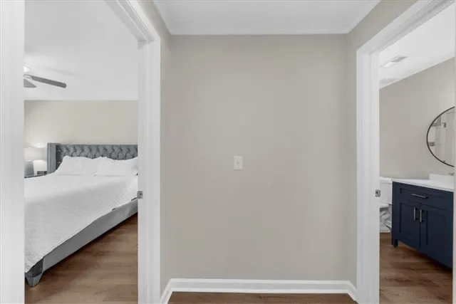 a bedroom with a bed and a mirror