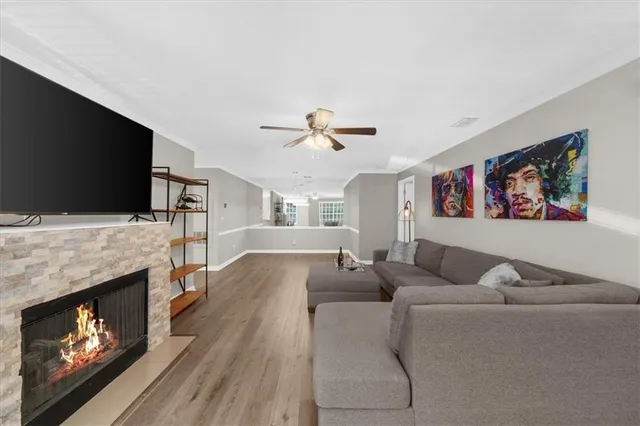 a living room with furniture fireplace and flat screen tv
