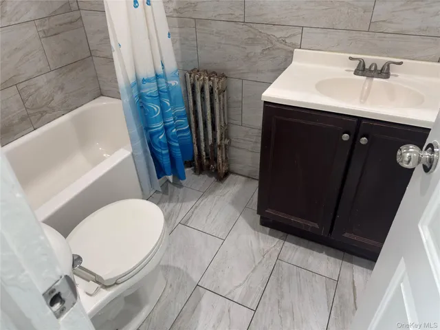 a view of room with wooden floor