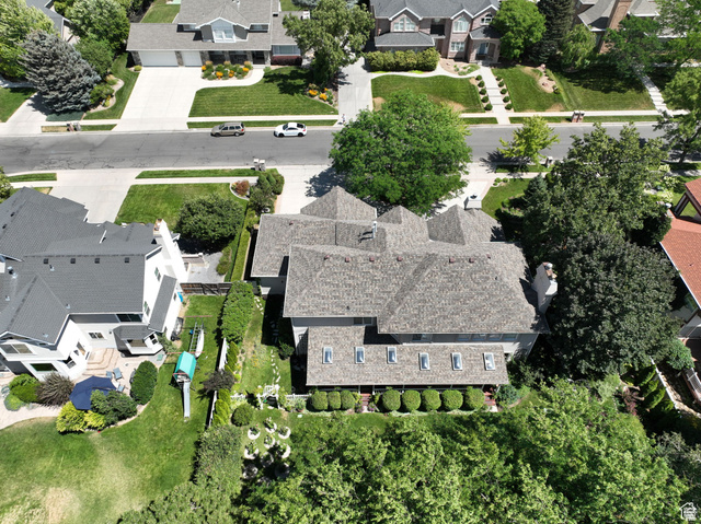 7740 Keswick Road Sandy, UT 84093 - Photo 67 of 74 Aerial perspective showcasing a residential property with a multi-gabled roofline and multiple chimneys