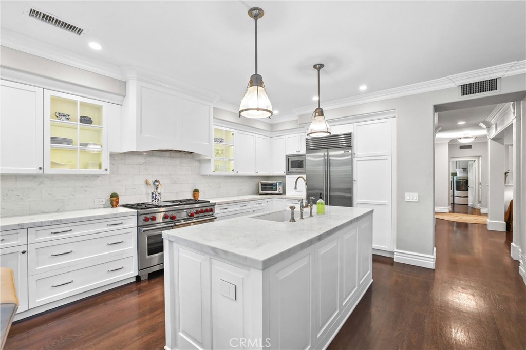 18 Lyon Newport Coast, CA 92657 - Photo 14 of 45 a kitchen that has a lot of cabinets in it