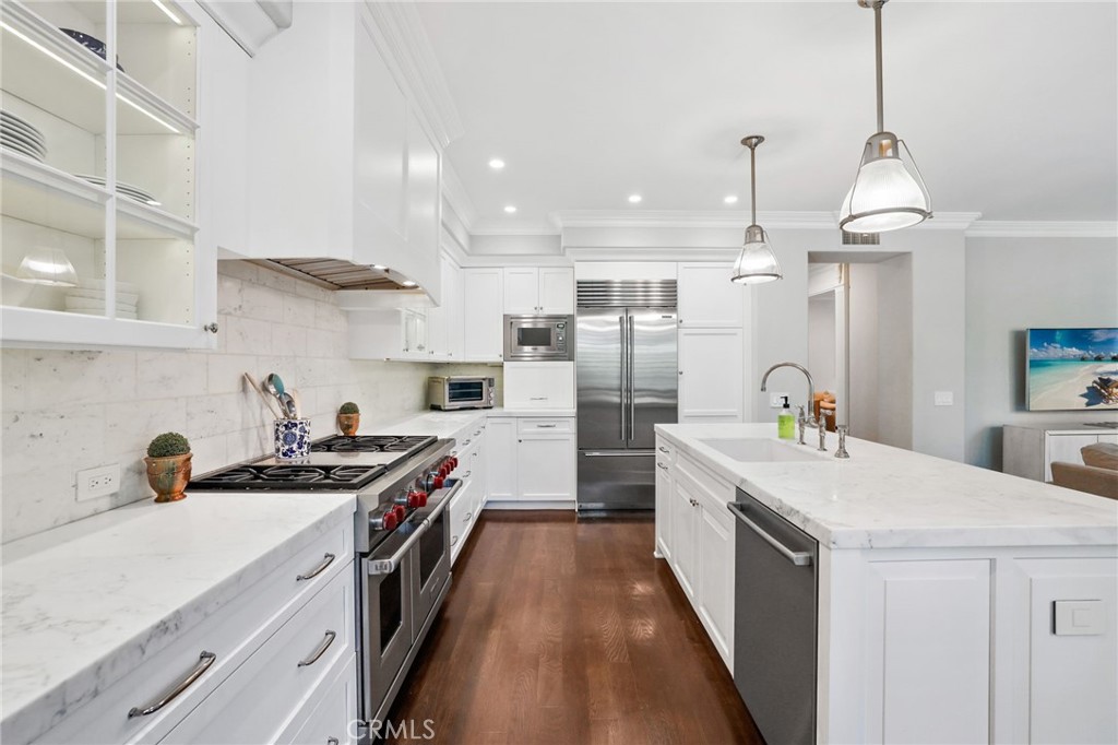 18 Lyon Newport Coast, CA 92657 - Photo 15 of 45 a kitchen with stainless steel appliances a sink stove and refrigerator