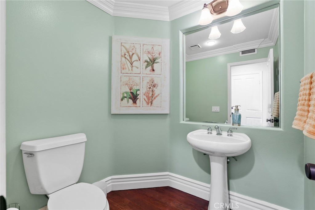 18 Lyon Newport Coast, CA 92657 - Photo 18 of 45 a bathroom with a toilet sink and mirror