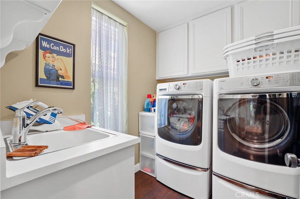 18 Lyon Newport Coast, CA 92657 - Photo 19 of 45 a utility room with dryer and washer