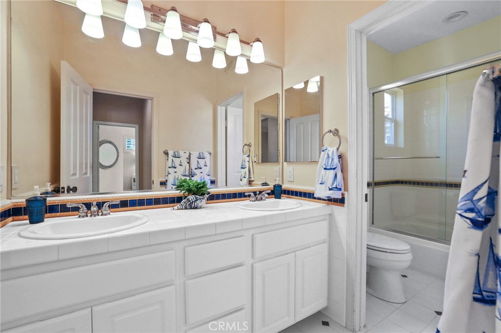 18 Lyon Newport Coast, CA 92657 - Photo 27 of 45 a spacious bathroom with a double vanity sink mirror and toilet