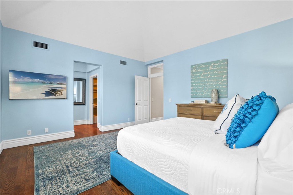 18 Lyon Newport Coast, CA 92657 - Photo 30 of 45 a bedroom with a bed and wooden floor