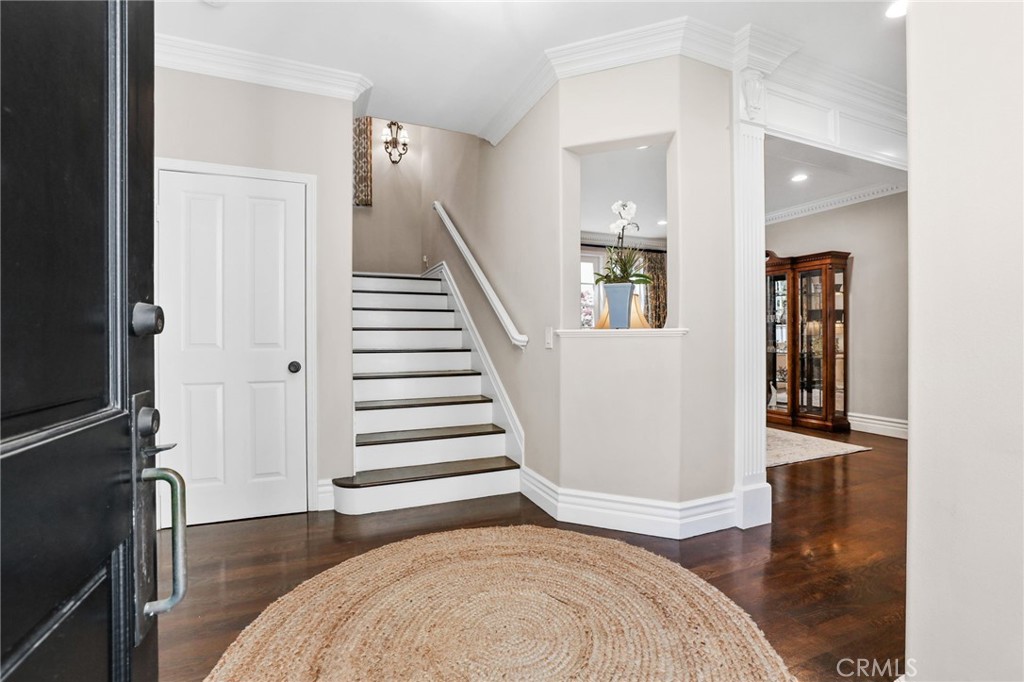 18 Lyon Newport Coast, CA 92657 - Photo 3 of 45 a view of a bedroom with wooden floor and stairs