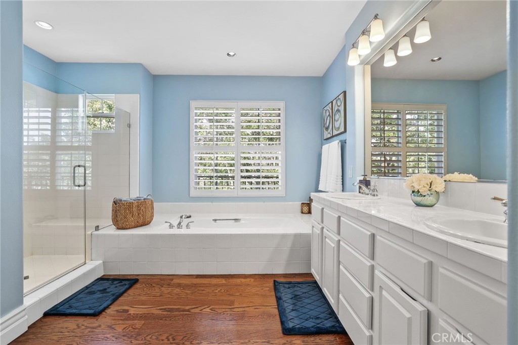18 Lyon Newport Coast, CA 92657 - Photo 32 of 45 a bathroom with a tub a double vanity sink a window and mirror