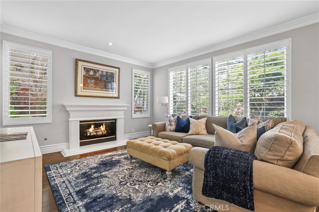 18 Lyon Newport Coast, CA 92657 - Photo 9 of 45 a living room with furniture and a fireplace