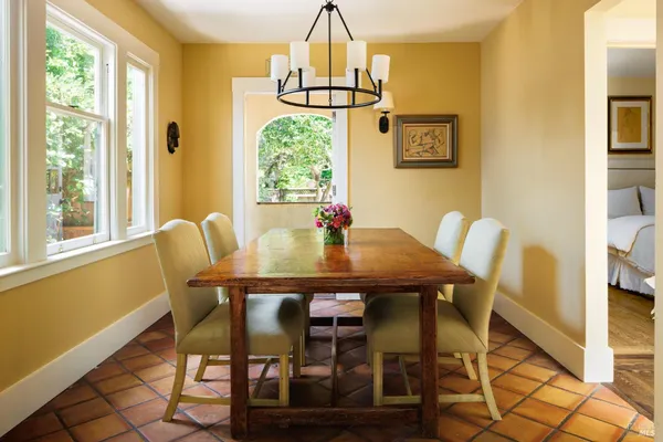 a dining room with furniture and window